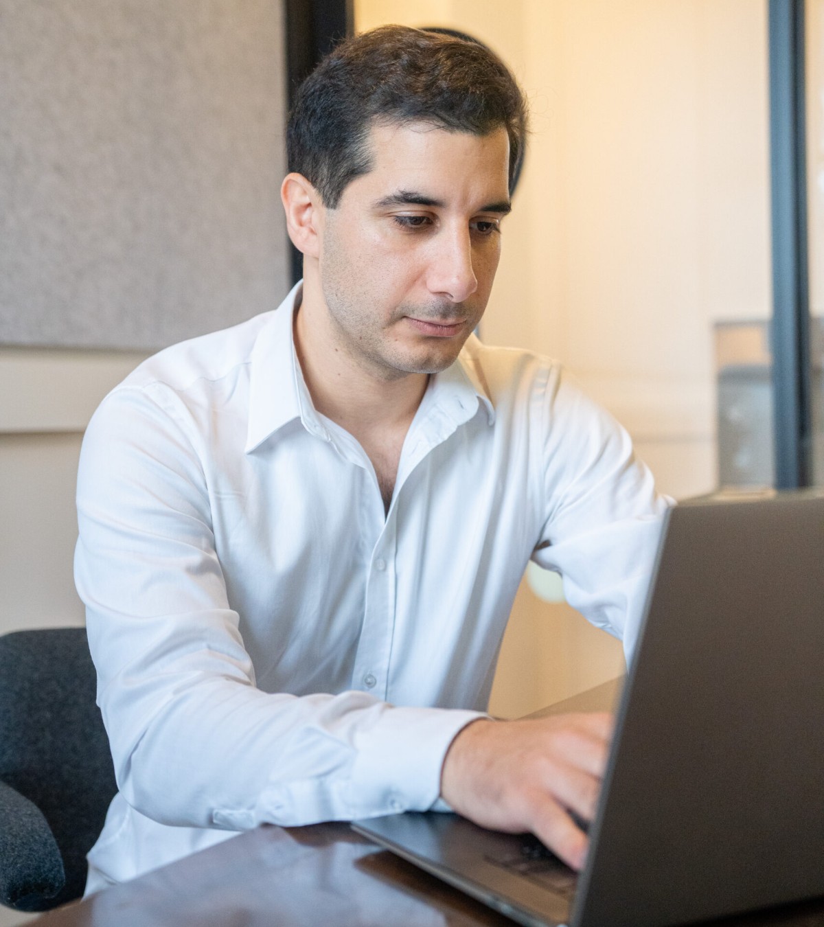 Martin Walian, CEO of EUUK Compliance, working at his desk